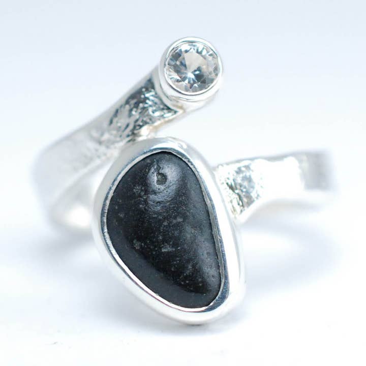 Silver ring with white Sapphire and raw black stone. for wholesale by Ami jewel