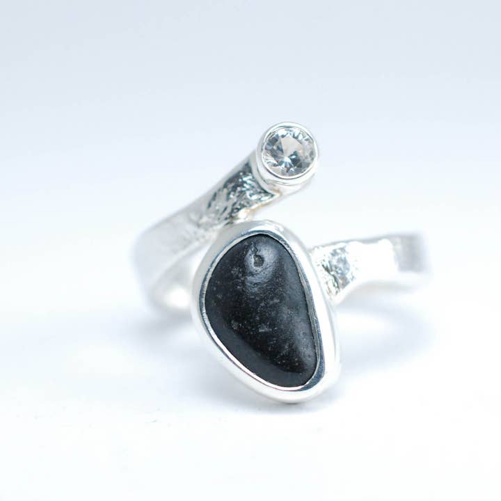 Silver ring with white Sapphire and raw black stone. for wholesale by Ami jewel