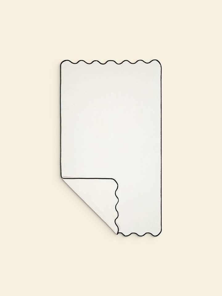 The wavy bath sheet in ivory & black cotton for wholesale by Tomète