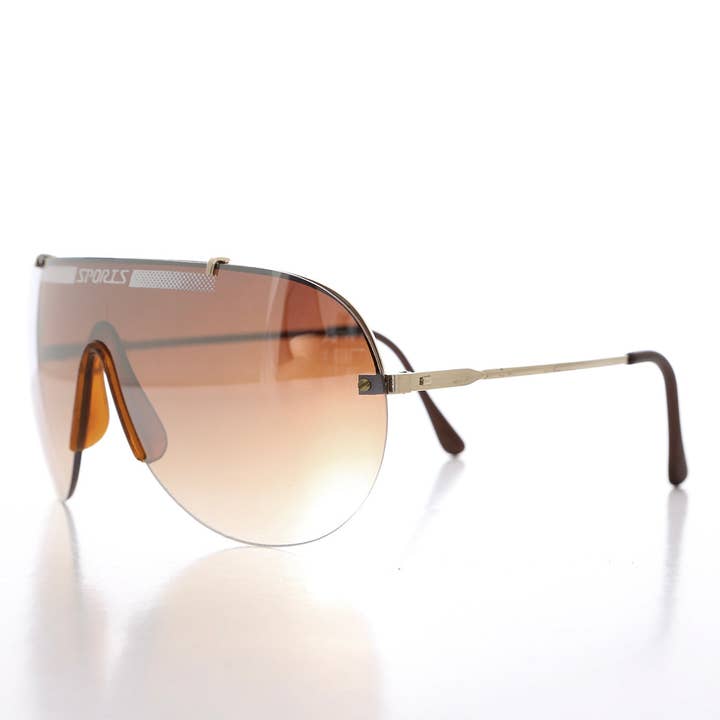 SUNGLASS MUSEUM - Wholesale Sunglasses - Unisex - Rimless 80s Aviator Sunglasses - Exit1