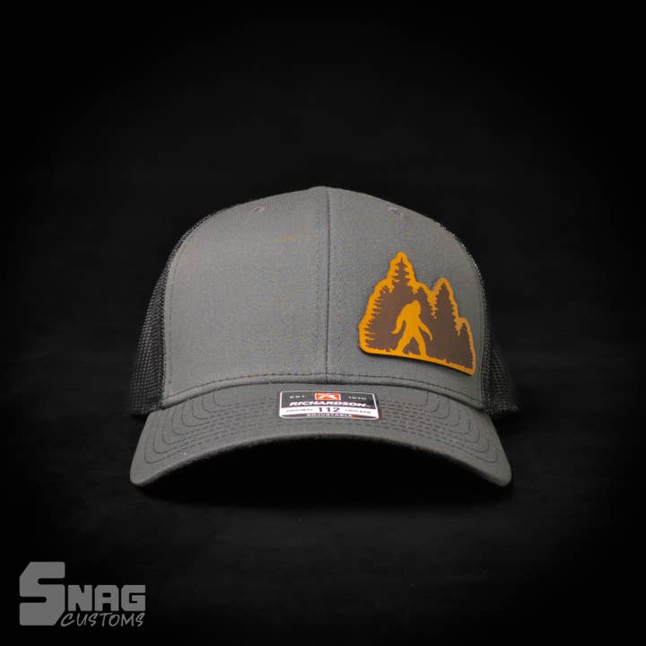 Snag Customs - Wholesale Trucker Hat - Unisex - Woods/Forest Sasquatch, Yeti, Bigfoot Leather Patch Hat3