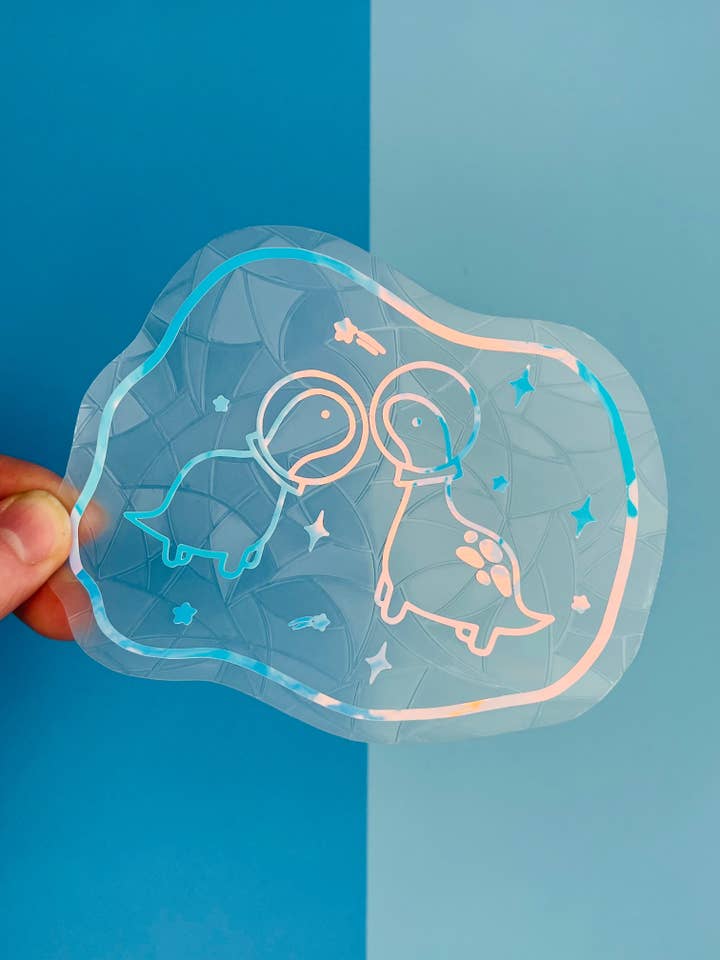 Space Dinos Suncatcher for wholesale by Poppodopolis