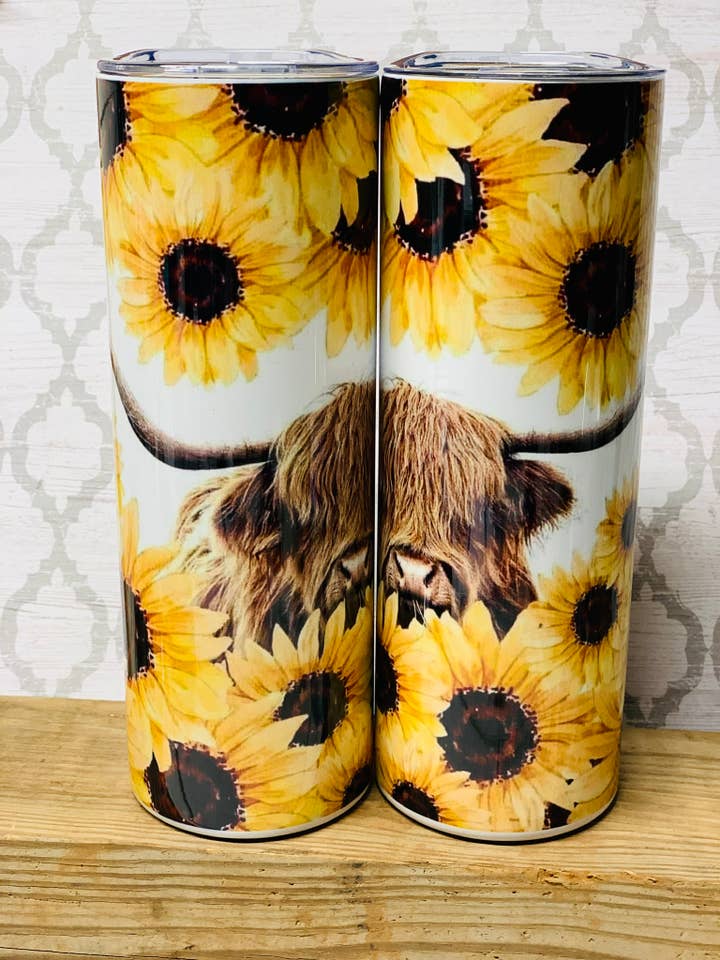 Sunflower highland cow 20oz skinny stainless steel tumbler for wholesale by Indigo Sky Mercantile