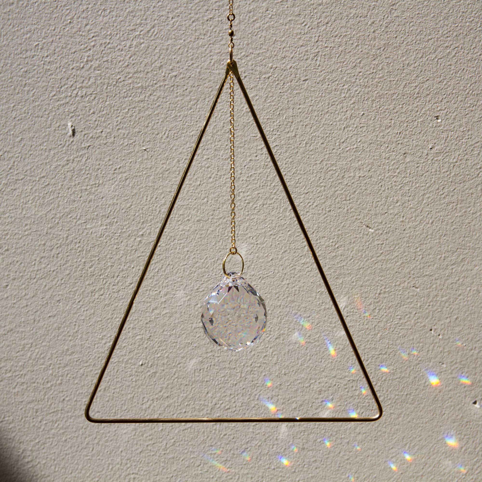 Sol Proaño - Wholesale Suncatcher - Prisma 21 Triangle Brass Suncatcher4