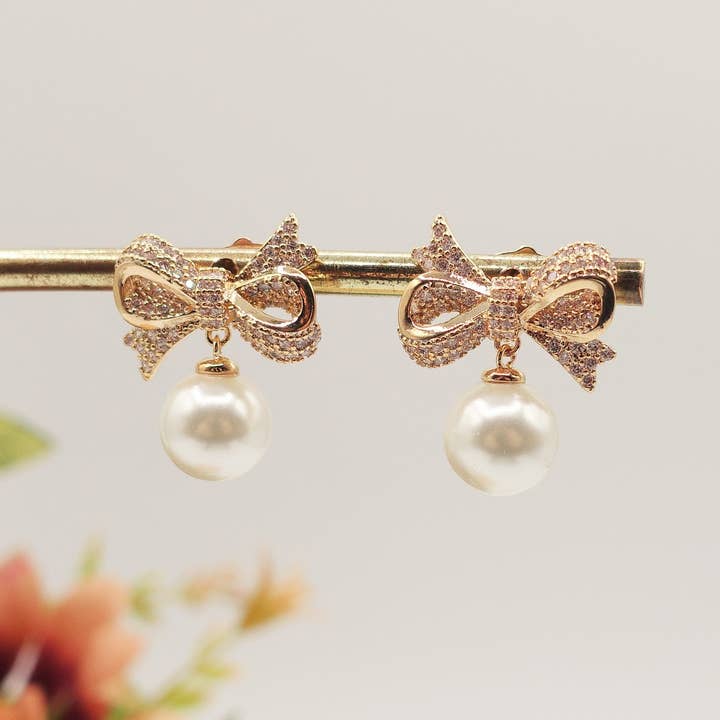 CALLA pendant ~ orecchini bottone con fiocco zirconato e perla for wholesale by Daemon srls