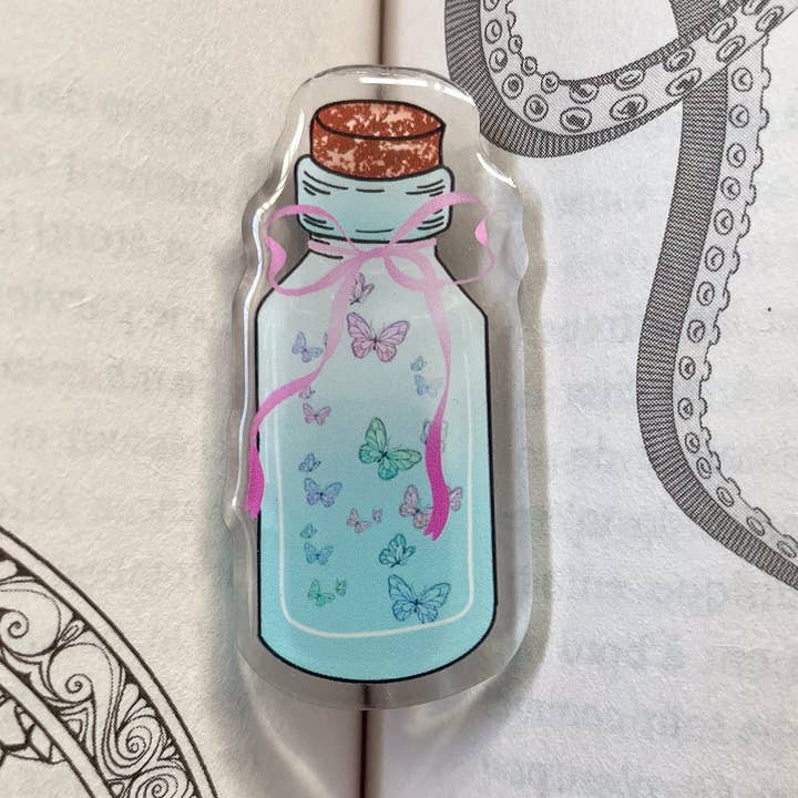 Enchanted " butterfly bottle" acrylic pin for wholesale by Annie's paper studio