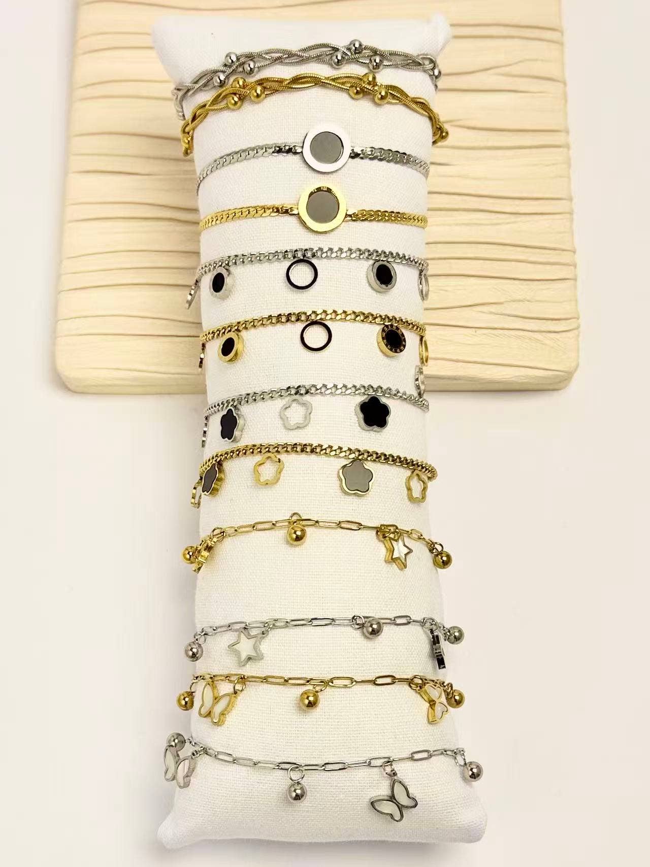 COSMOS - Wholesale Jewelry Set - Set of 12 gold and silver charm bracelets in steel1