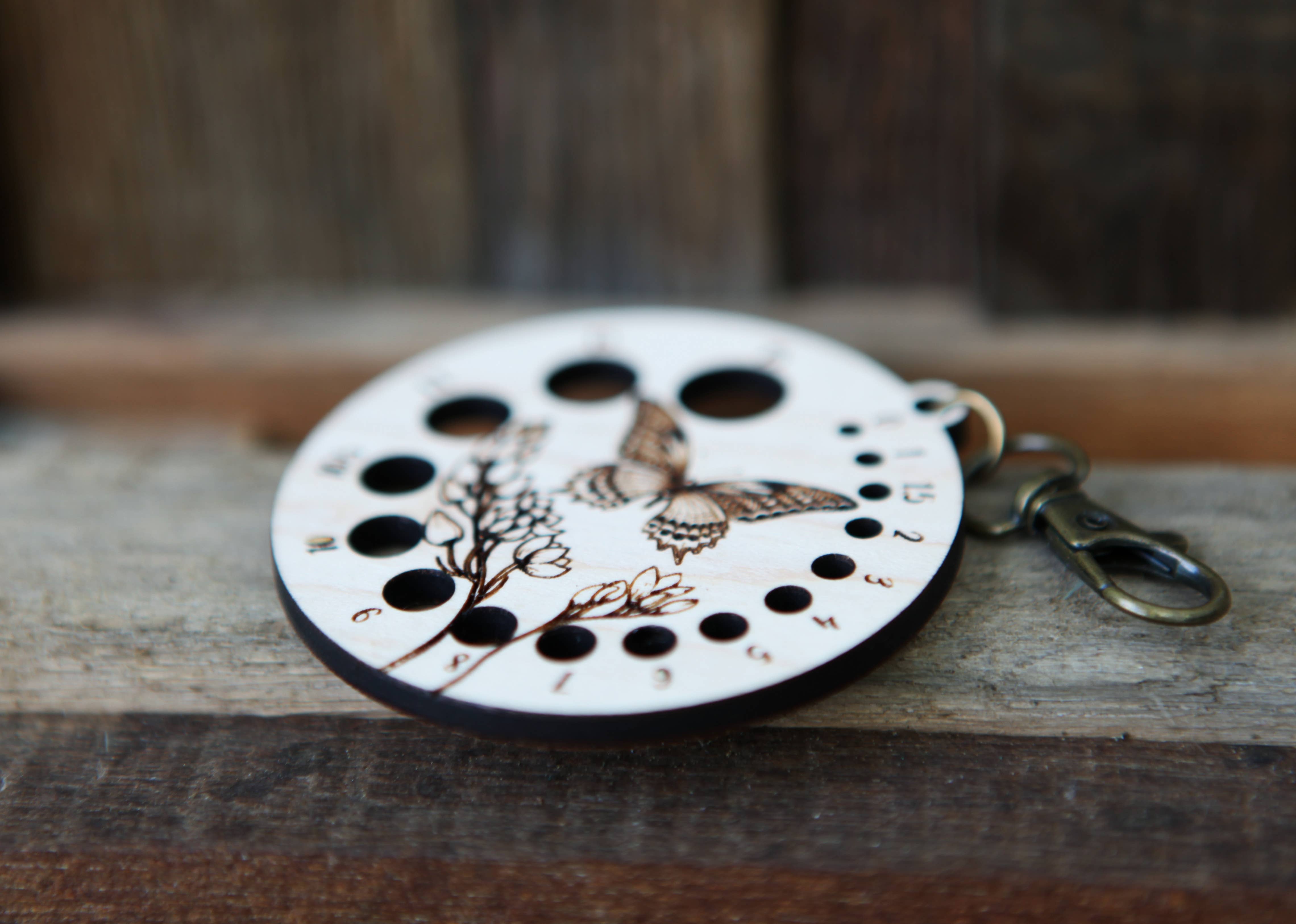 Sunrise Grove - Wholesale Knitting/Crochet Supplies - Butterfly with Flower Needle Gauge with Bronze Clasp 7