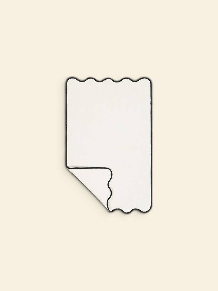 The wavy bath mat in ivory & black cotton for wholesale by Tomète