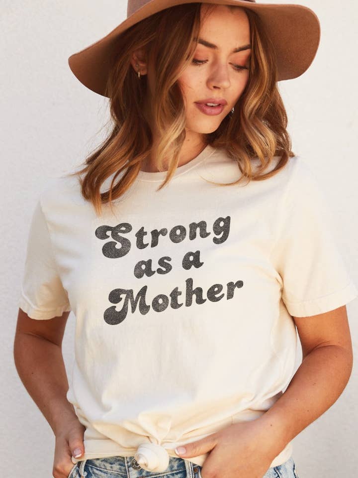 STRONG AS A MOTHER  Graphic T-Shirt and other Purchase Wholesale mom tshirts. Free Returns & Net 60 Terms on Faire trending on Faire.