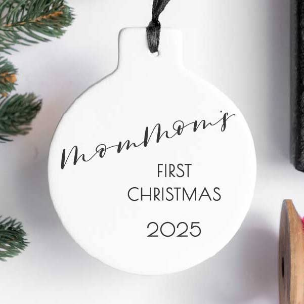 MomMom's First Christmas 2025 for wholesale by Girl Holding a Pen