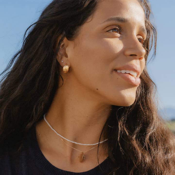 Gold Plated Sol Crossover Hoop Earrings for wholesale on Faire1