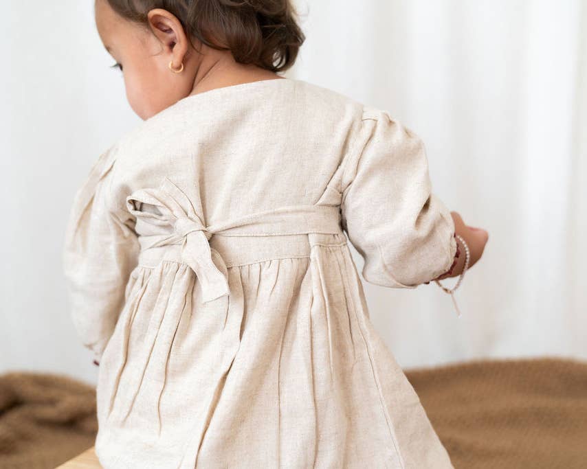 Natural Ravello Embroidered Baby Dress & Bloomer (Linen Blend) for wholesale on Faire9