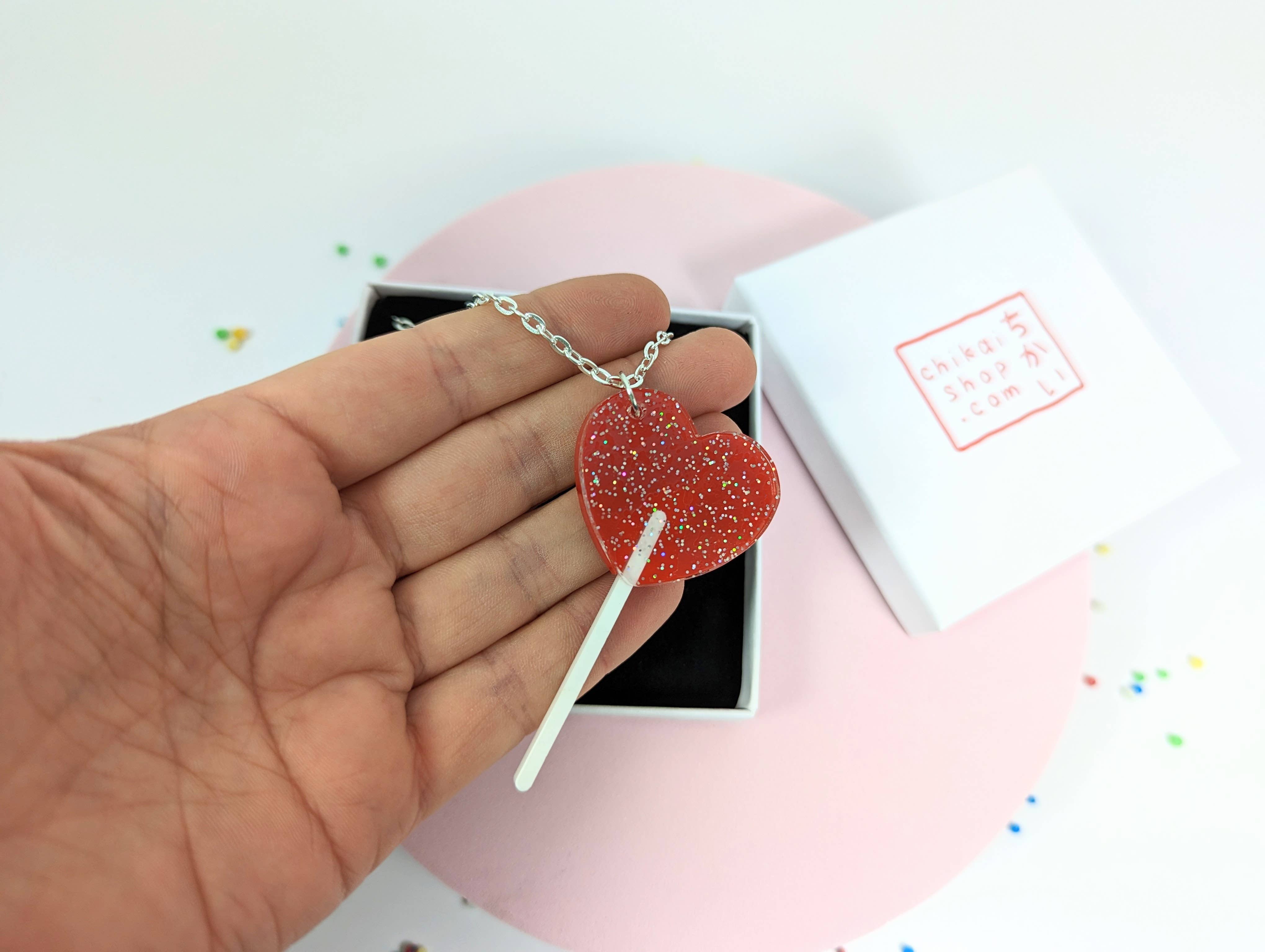 Chikai Shop – wholesale Pendant/charm necklace – Lollipop heart necklace on acrylic with silver plated chain2