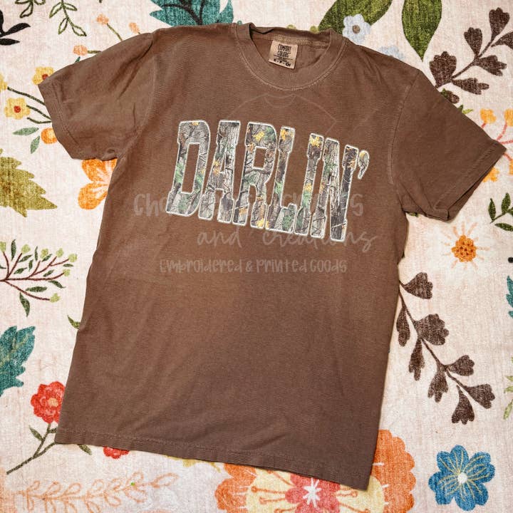 "DARLIN'" CAMO GRAPHIC TEE for wholesale by Chandler’s Crafts and Creations