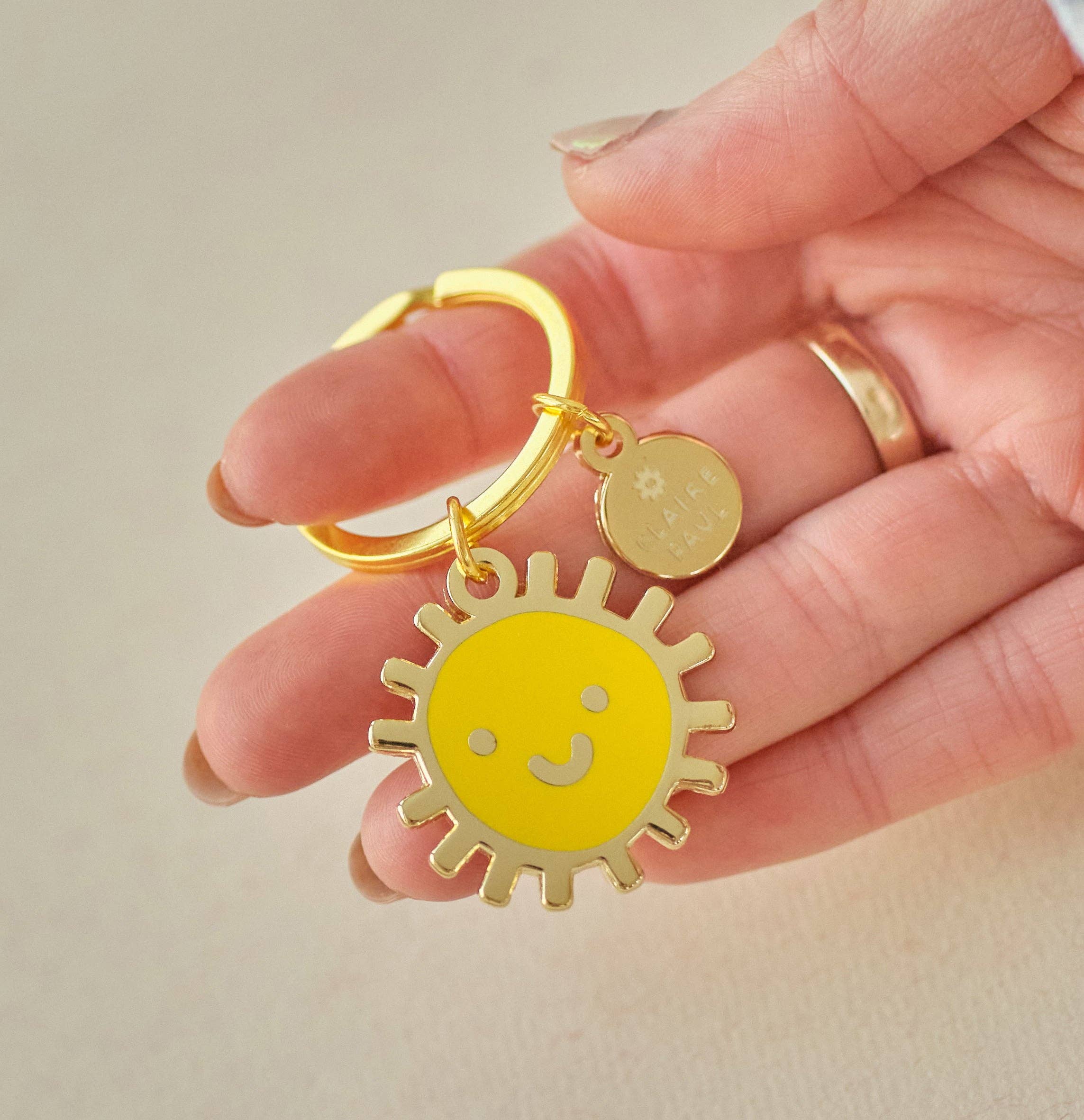 Claire Paul – wholesale Keychain – Women's – Smiley Sun Keyring Charm