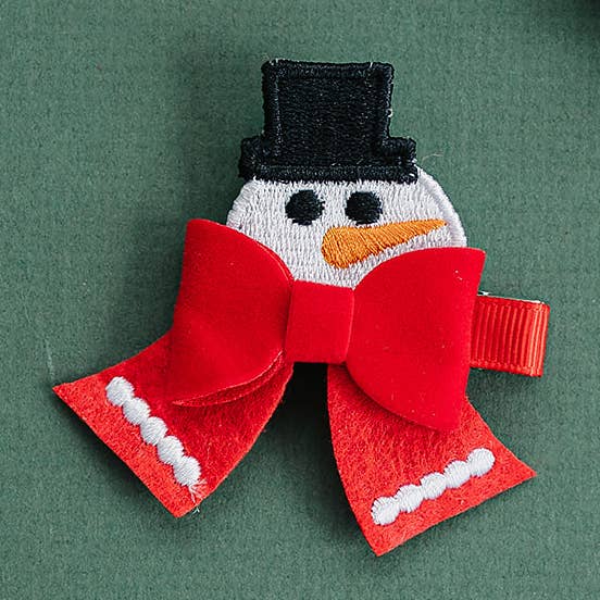 Petit nœud à cheveux brodé en forme de bonhomme de neige pour la vente par Golden Dot Lane