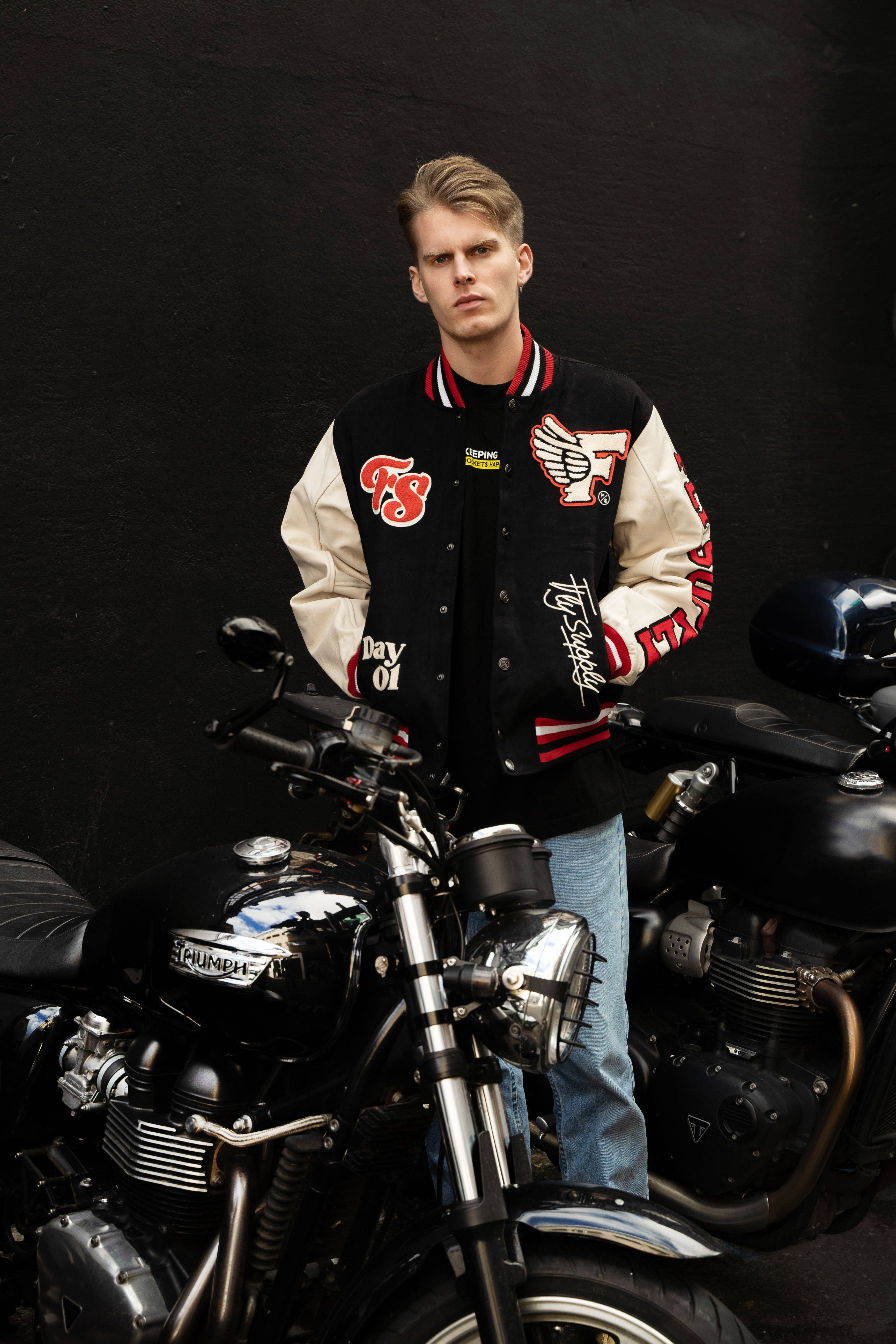 Denim Manifest Varsity Jacket (Black) for wholesale on Faire14