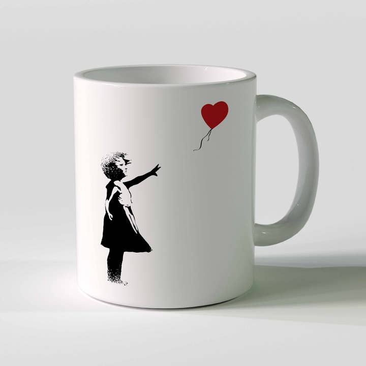 URBAN.ITY SRL - Venta al por mayor Taza - Taza de cerámica Banksy, 325 ml, con diseño de niña con globo rojo