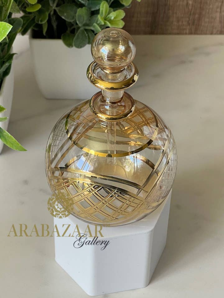 Egyptian Perfume bottle Flat Globe Shape W/14 K Gold Trim & Hand Engraving for wholesale by Arabazaar Gallery LLC