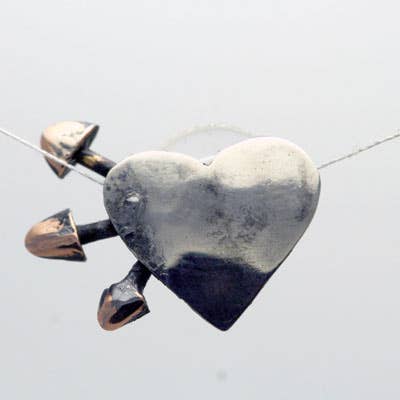 Small Oxidized Sterling Heart Studs with Tombac Arrows for wholesale by Moosepablos, Inc.