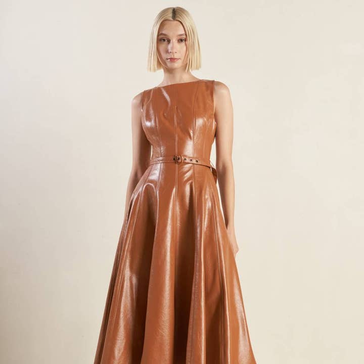 A faux leather midi dress - FD1294 and other Purchase Wholesale pu leather material. Free Returns & Net 60 Terms on Faire trending on Faire.