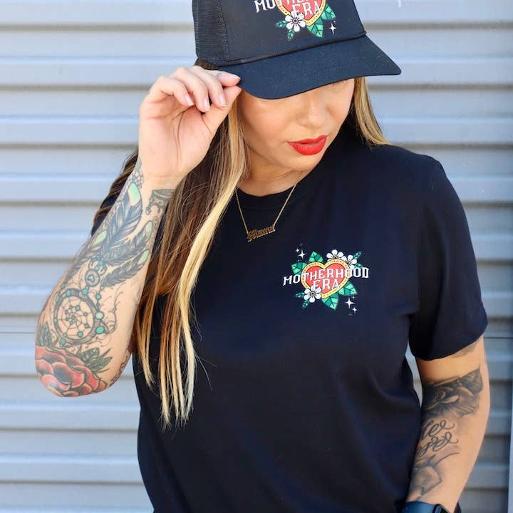 Black Tattoo Motherhood Era Trucker Hat for wholesale on Faire