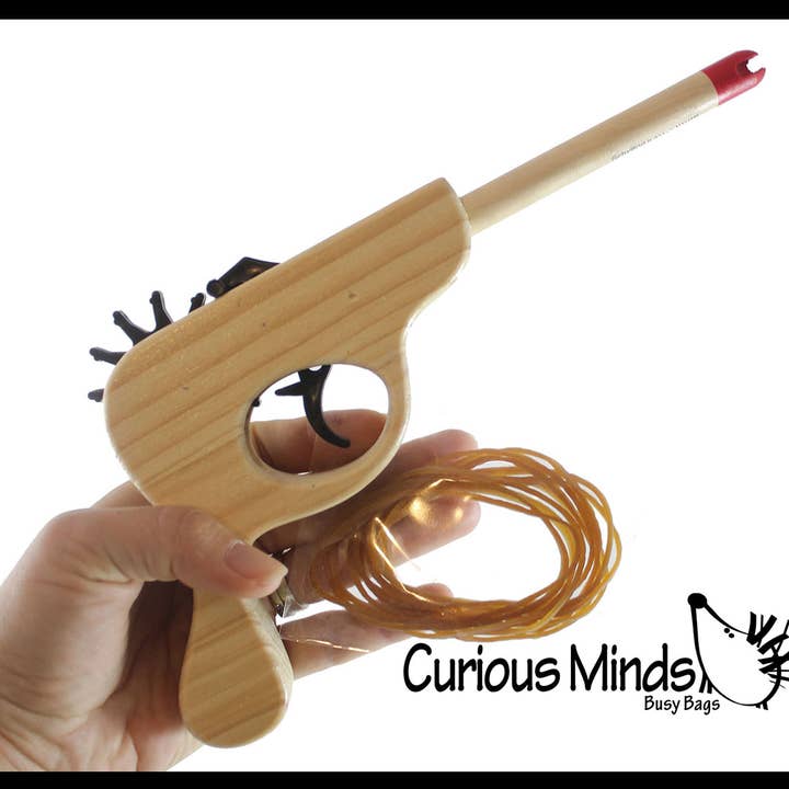 WOOD Rubber Band Toy Gun - Rubber Band Shooter - Vintage and other Purchase Wholesale rubber bands. Free Returns & Net 60 Terms on Faire trending on Faire.