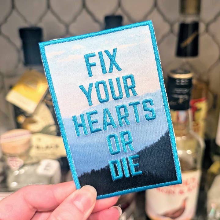 Emblema termocolante "Fix Your Hearts" (versão Blue Pine Mountain) por atacado de Cunning Linguist Co.