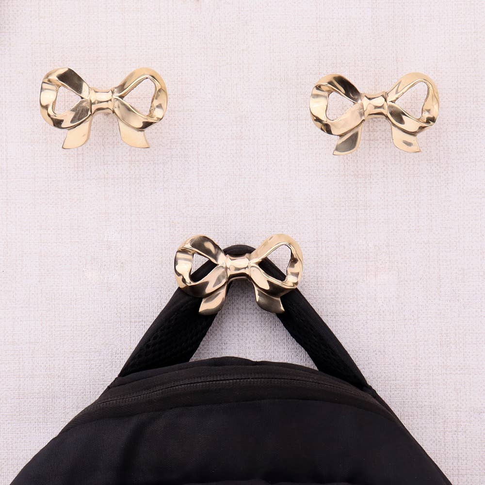 3 Piece Brass Bow Modern Coat Hooks Gold for wholesale on Faire0