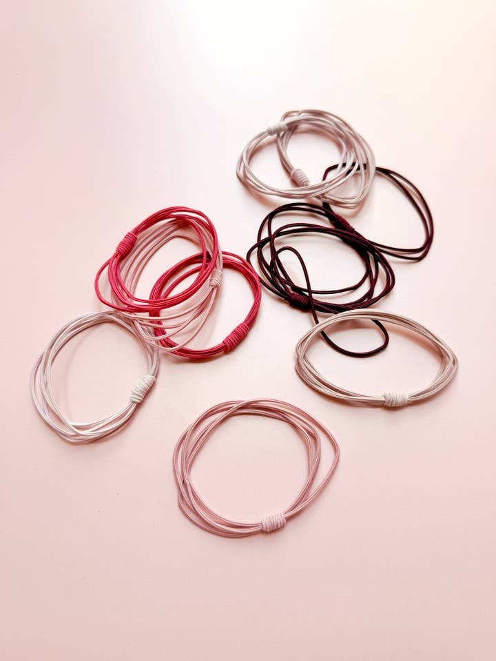 Colección de 8 coleteros elásticos con tiras en tonos rosa. para venta al por mayor de PopFizzCheers