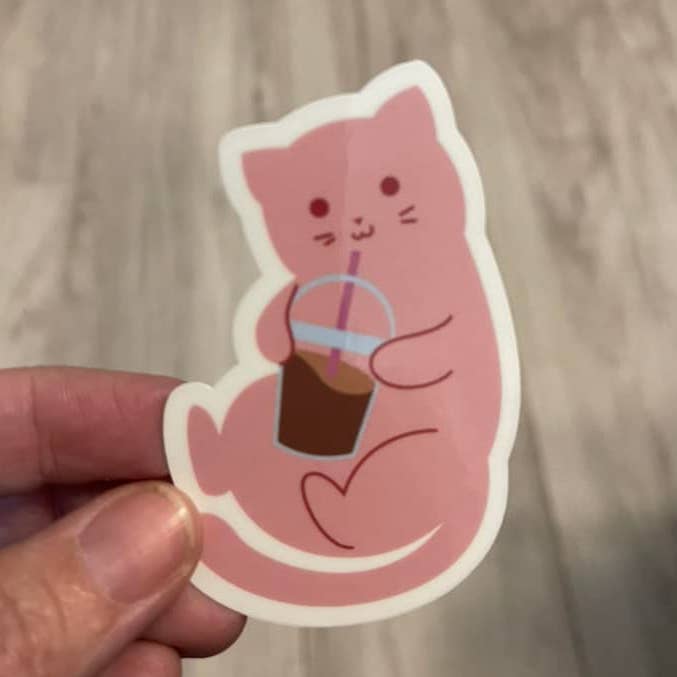 Pink Cat Drinking Iced Coffee Die Cut Vinyl Sticker for wholesale by Prairie Chicken Sticker Shop & Gifts