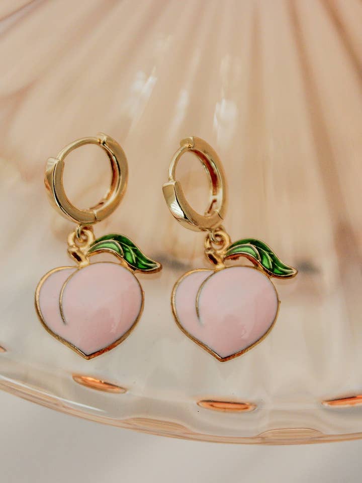 Peach Huggie Hoops for wholesale by The Golden Girl Co.