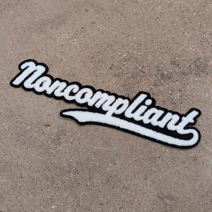 Noncompliant chenille iron-on patch for wholesale by Cunning Linguist Co.