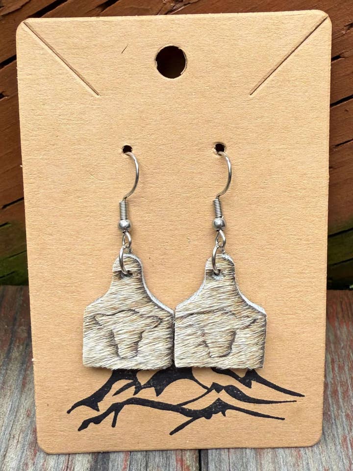 Hair-On Cowhide Cow Head Embossed Leather Cow Tag Earrings for wholesale by Wild Mountain Soul Designs