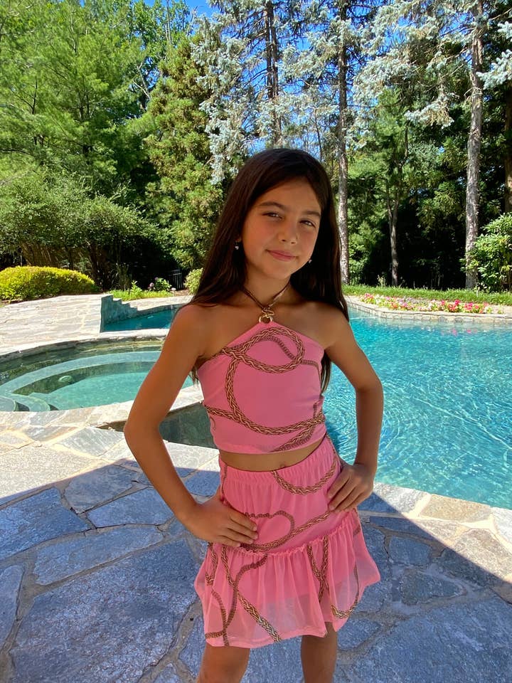 Gonna corta con volant e catene rosa per la vendita all'ingrosso da parte di Les Tout Petits