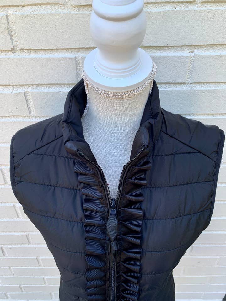 Maggie May Ruffle Puffer Vest - Black w Black Ribbon for wholesale on Faire