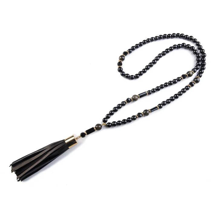 Collar de cuentas de ónix negro con borla de cuero y acento dorado para venta al por mayor de The Dark