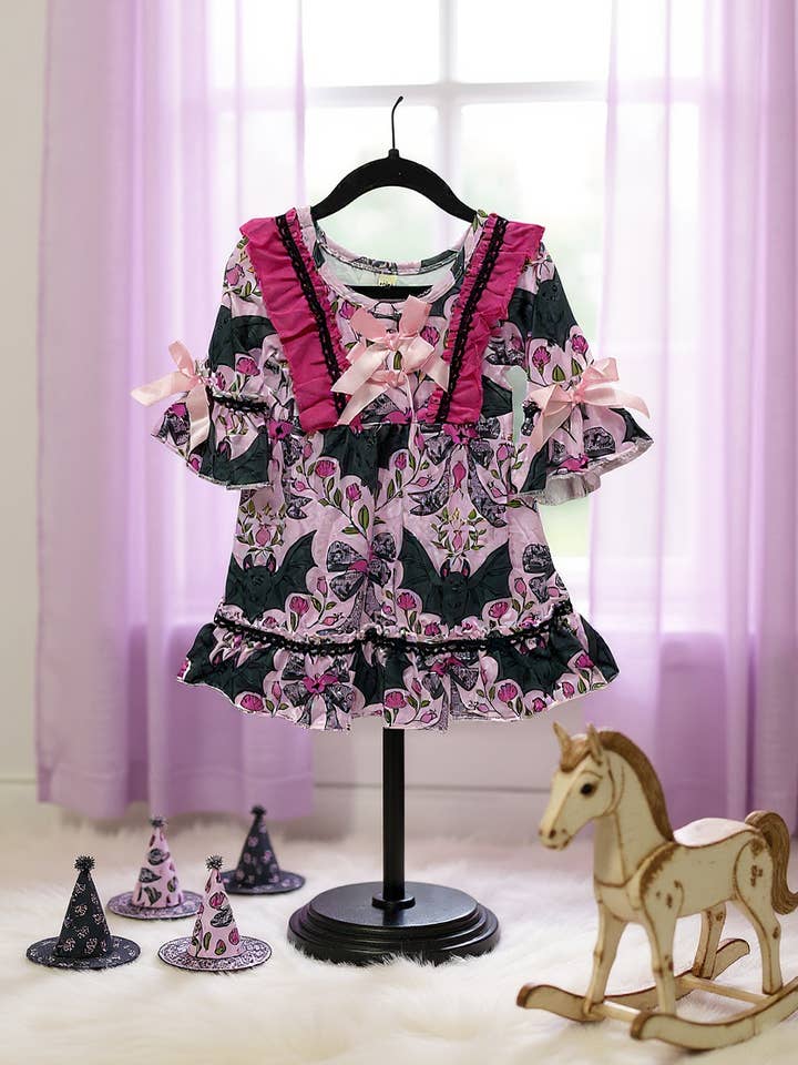 Bat multi printed girls ruffle hem dress. GLD062102-Jean for wholesale by Kids Charm Online