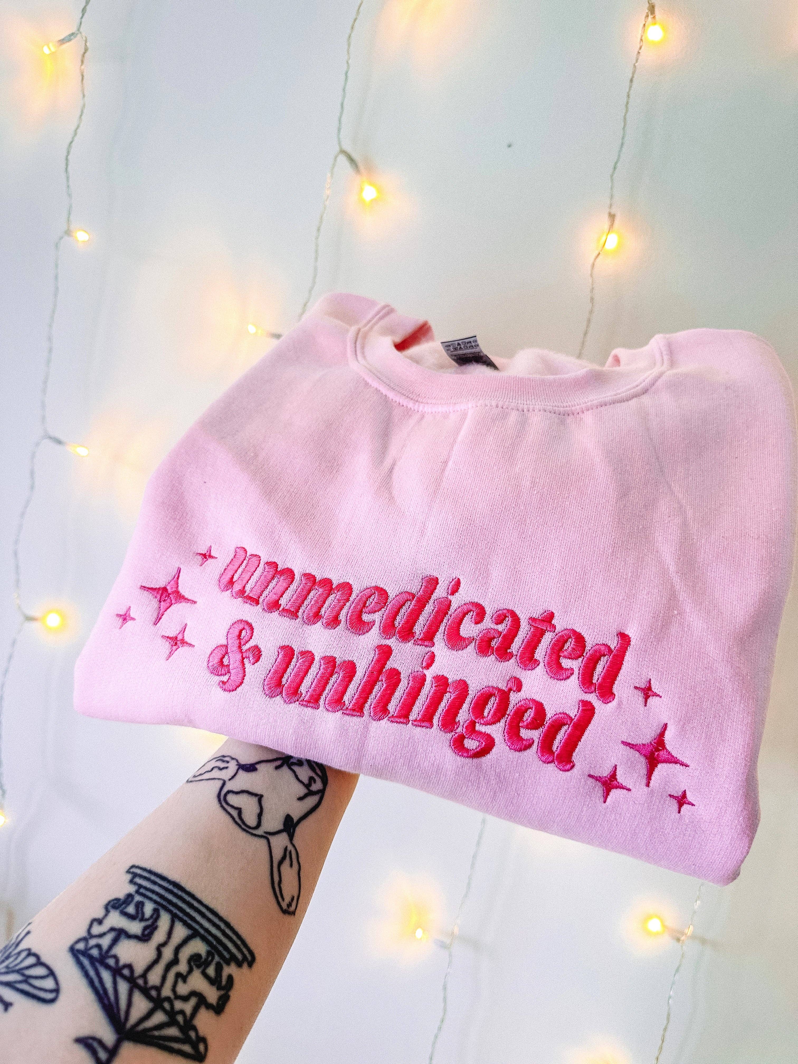 Tired Girl Apparel – wholesale Sweatshirt – Women's – Unmedicated & Unhinged embroidered crewneck sweatshirt1