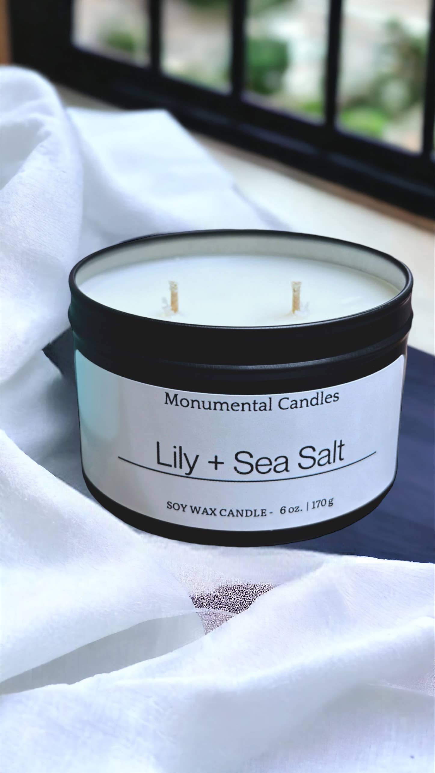 Monumental Candles LLC - Wholesale Travel candles - Lily + Sea Salt - 6 oz Matte Black Tin Candle0