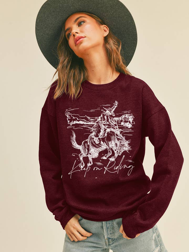Keep On Riding Cowboy Graphic Sweatshirt for wholesale by Honestee