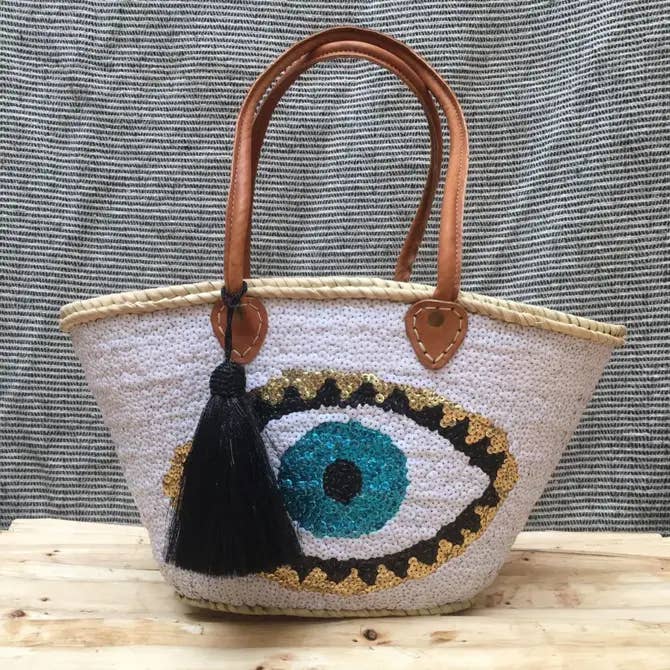 Fransk kurvetaske fuld pailletter med stort onde øjenmønster for engroshandel hos Terracotta Design LTD