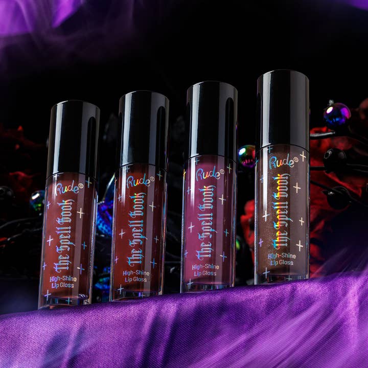 Le Gloss à Lèvres Brillant Spell Book pour la vente par Rude Cosmetics