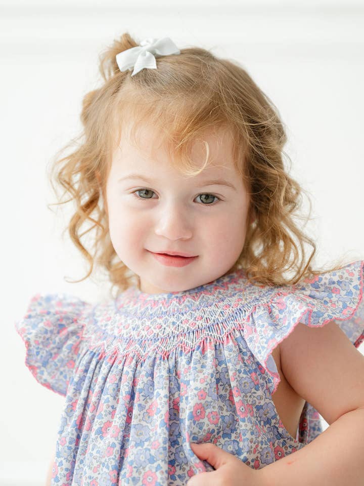 Periwinkle Poppy Floral Smocked Birdie Bubble for wholesale by Ruth and Ralph