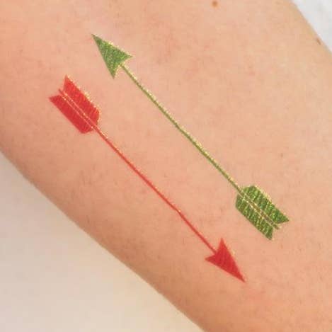 Tatuaggio GLITTER ARROWS (confezione da 2) per la vendita all'ingrosso da parte di Tattoonie