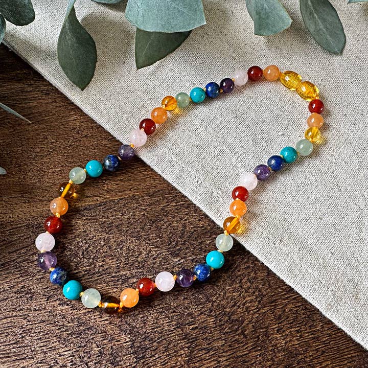 Chakra Rainbow gemstones necklace with Baltic amber for wholesale by Aventari