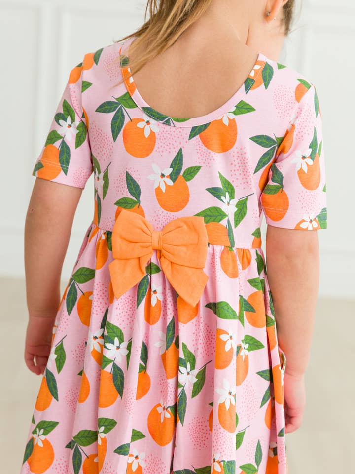 Girls Orange You The Sweetest Short Sleeve Knit Twirl Dress
for wholesale by RuffleButts + RuggedButts