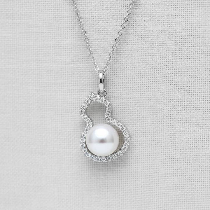 Hollow Gourd Pearl Earrings and Pendant Set for wholesale by camilla dovey