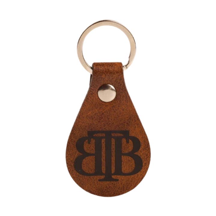 Portachiavi in pelle poliuretanica a doppia faccia con marchio TBB per la vendita all'ingrosso da parte di The Bearded Brotherhood